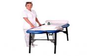 beautician standing close to massage table